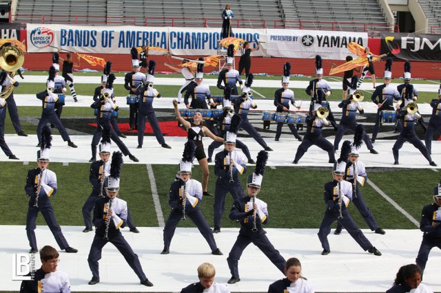 O'Fallon Township High School marching band and color guard performs on football field