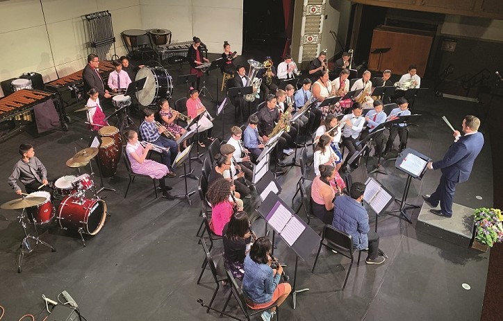 Taylor Smith conducting the music academy band