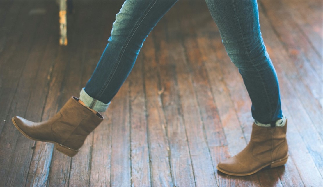 close up feet and legs with one foot in front of the other 