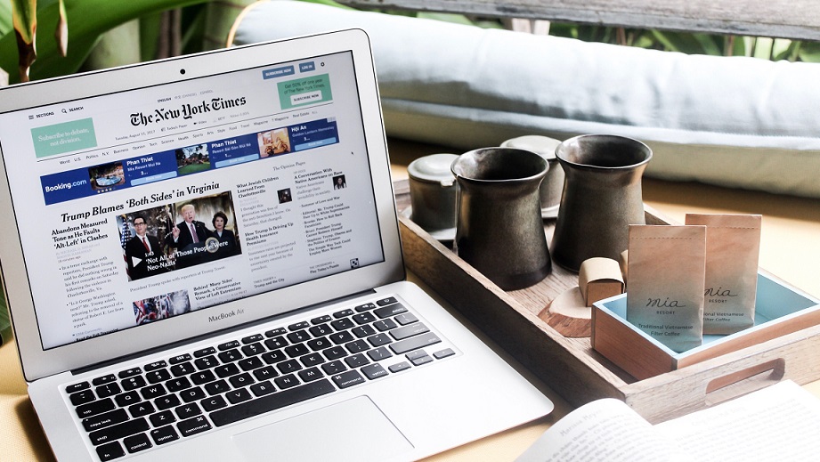 laptop showing news site on screen