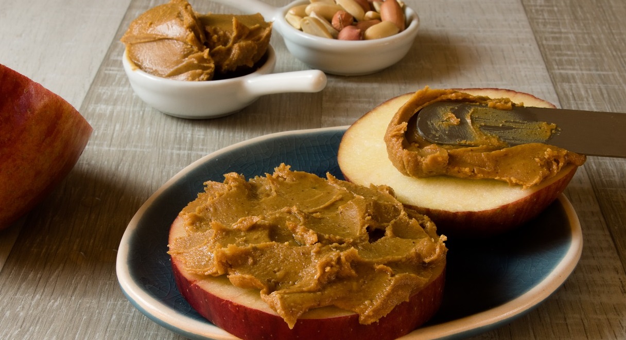 half apple smeared with peanut butter