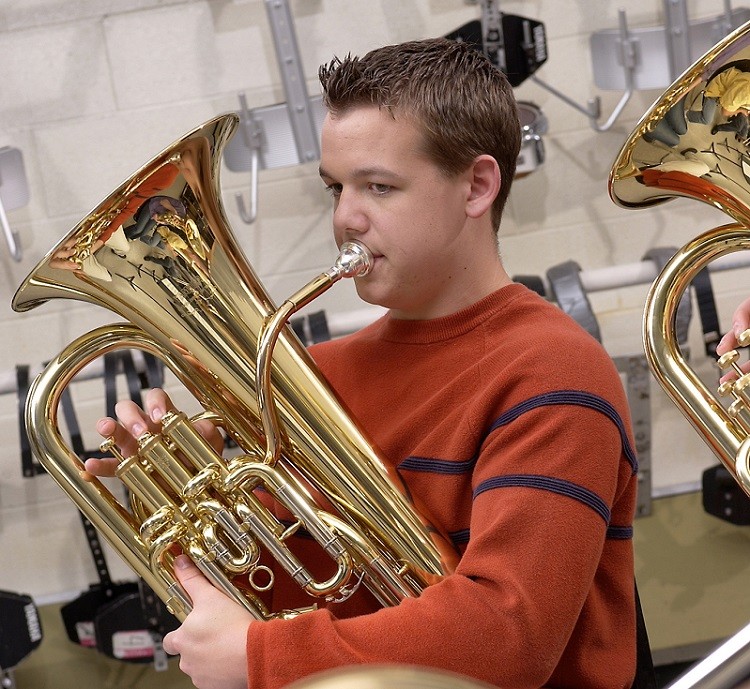 male student playing baritone