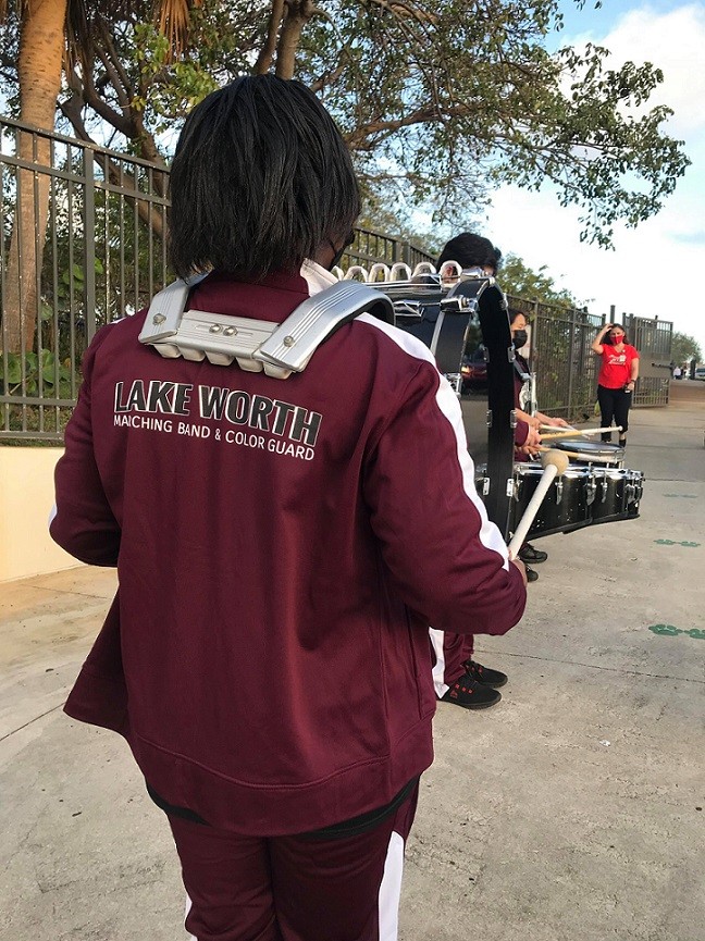 Lake Worth Community drumline member preparing to perform