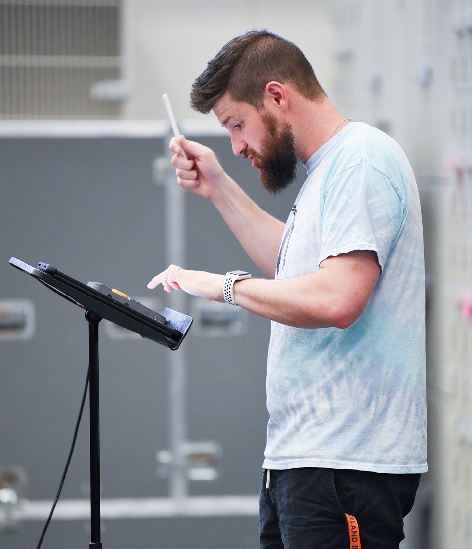 Brian Teed, Wakeland High School percussion director at music stand