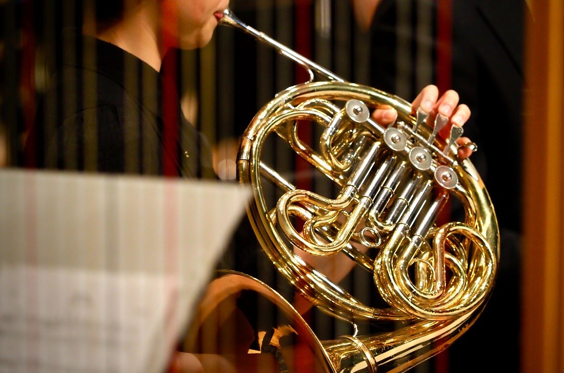 someone playing French horn 