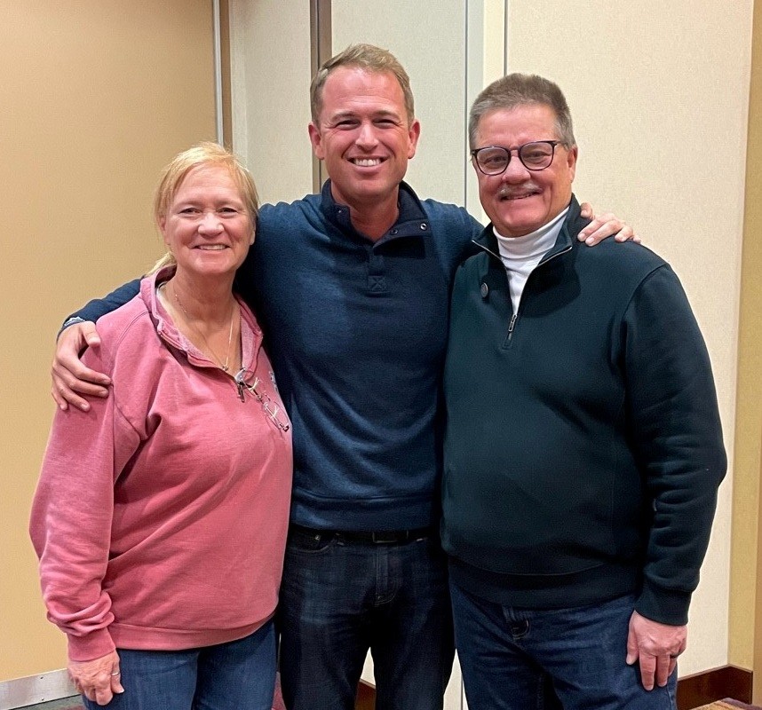 Jarrett Lipman (center) with Ginny and Mark Kraft, his high school choral and band directors