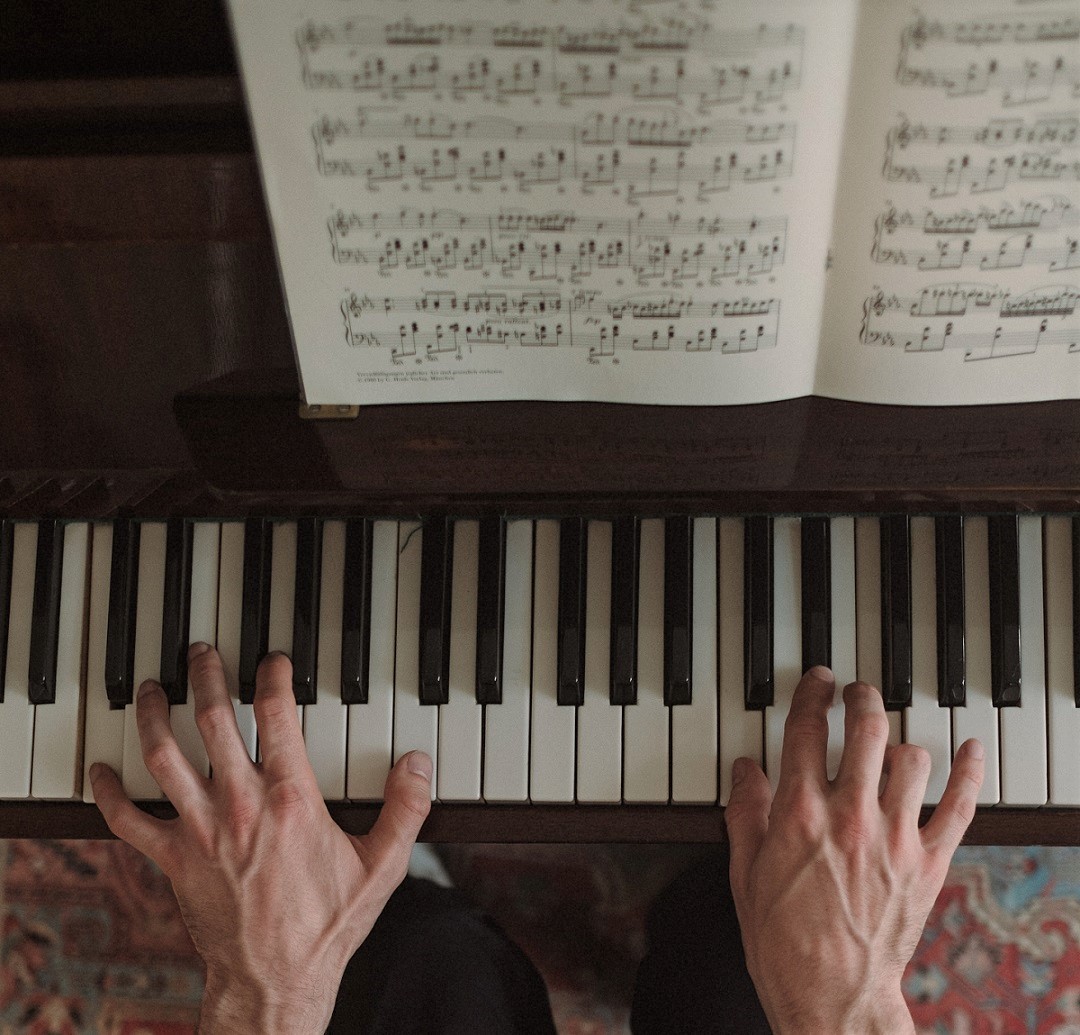 overhead shot man playing piano pexels