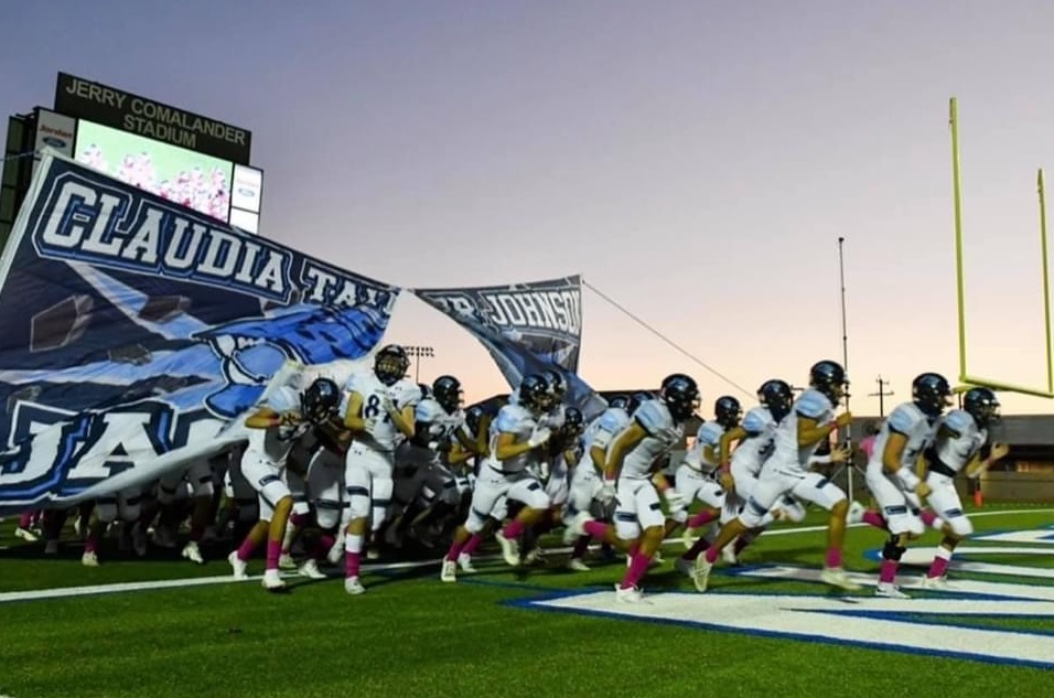 football team entering field