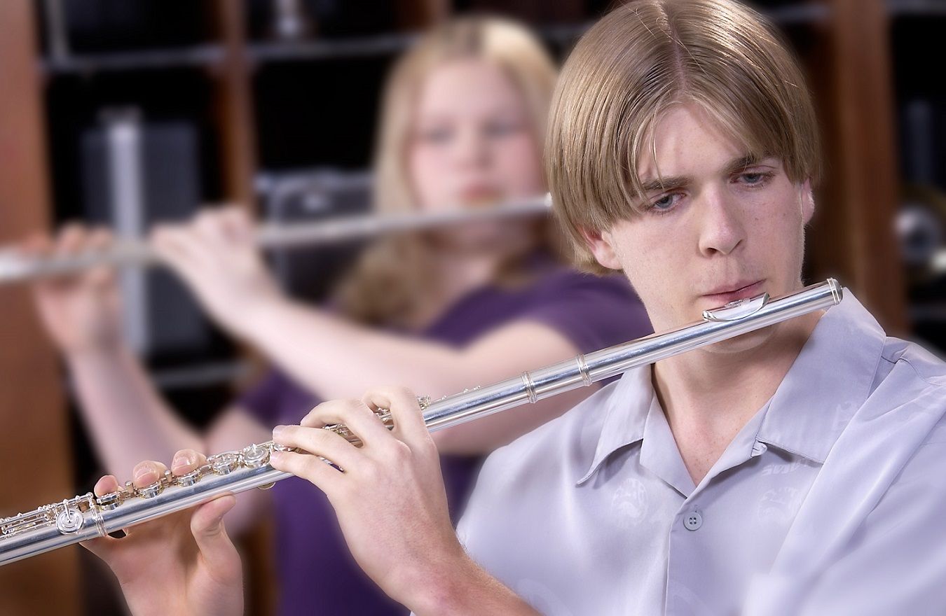 two students playing the flute