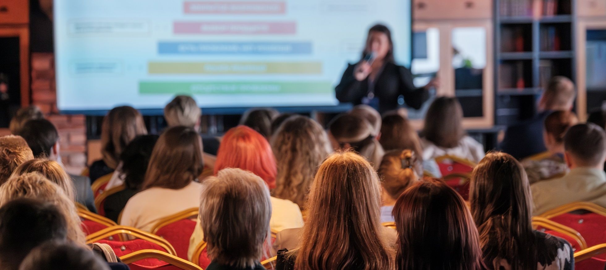 speaker in front of audience at conference