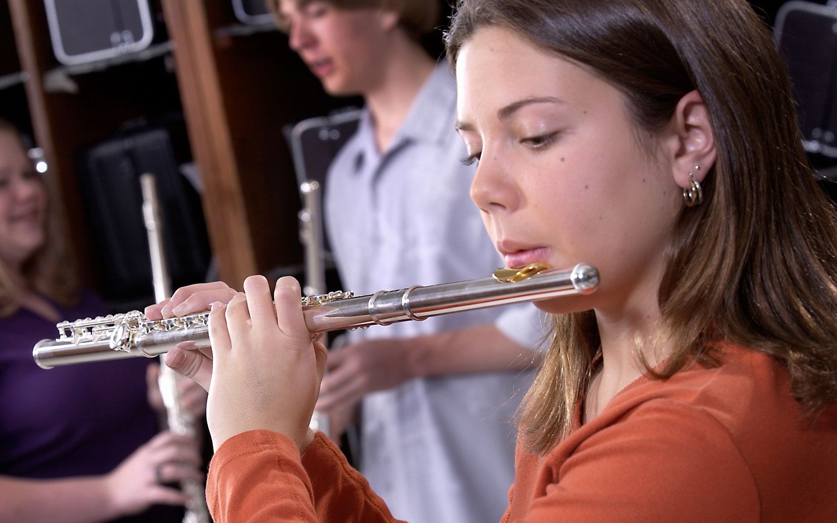 female student playing flute