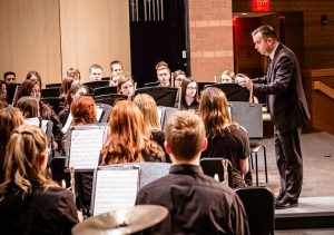 Chad Kohler conducting band