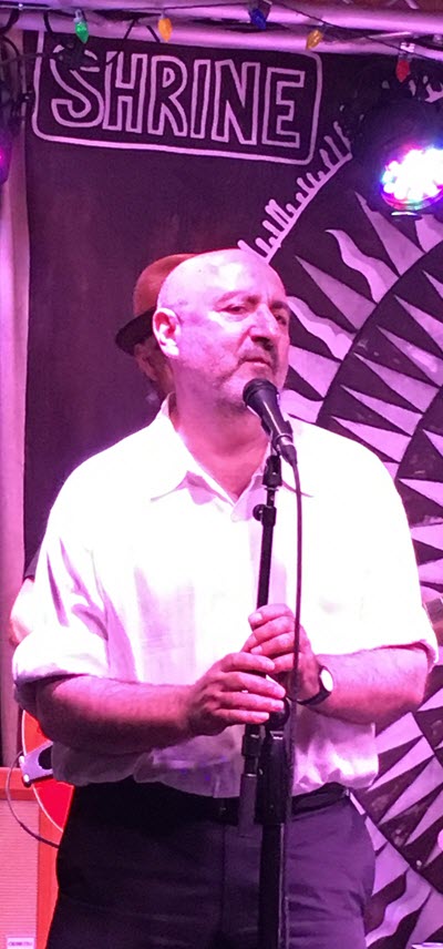 Man singing on stage.
