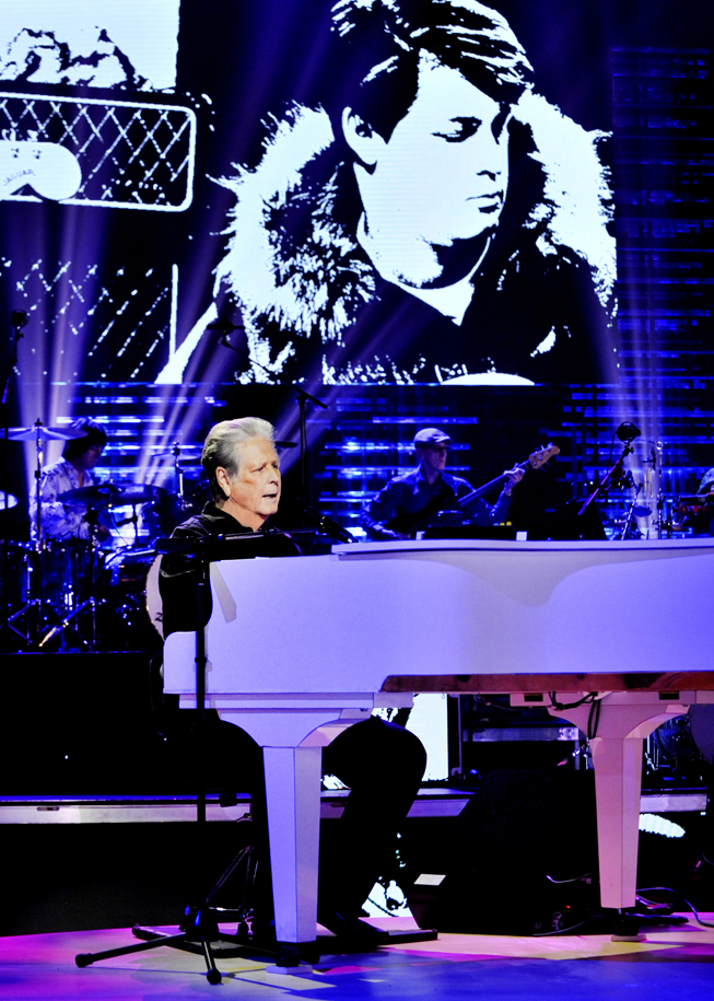 Art of Arranging body image Brian Wilson playing a grand piano.