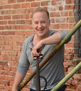 Christian Howes holding electric violin