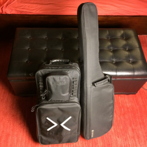 Black guitar and pedalboard cases.