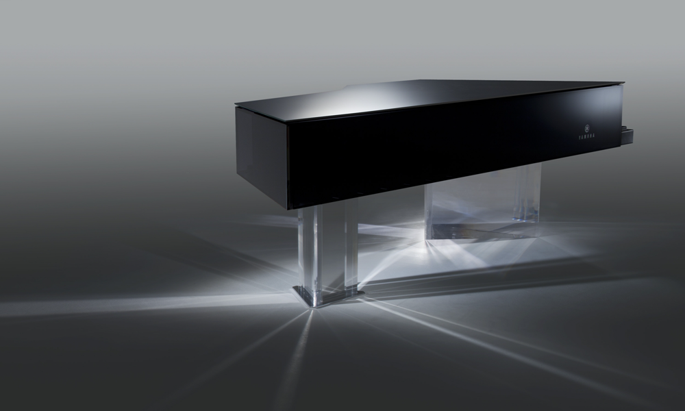eltonjohnMDP_body image 2 A black bodied custom piano with acrylic base.