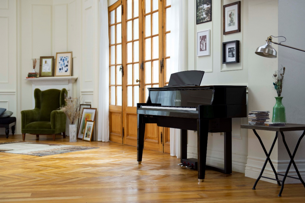 Electronic keyboard that looks almost like an upright piano in an apartment setting.