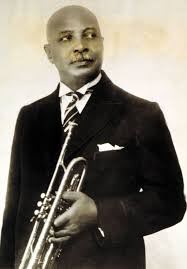wchandy An African American man in a suit and tie holding a trumpet.