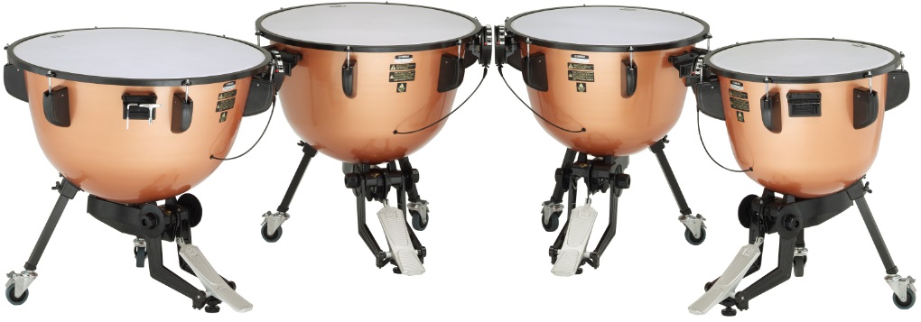 Set of four timpani drums in a curved row.