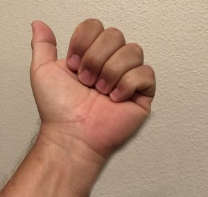 Warm-up-Image-2_Fist_Cropped_Shadow-Lessen Hand palm up with fingers curled as if forming the beginning of a fist.