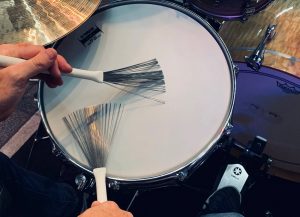 brushes_body-image1400 Closeup of someone playing a snare with brushes.