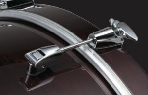 Components_Bass_Fig3 Close-up shot of silver bass drum claw on deep read bass drum.