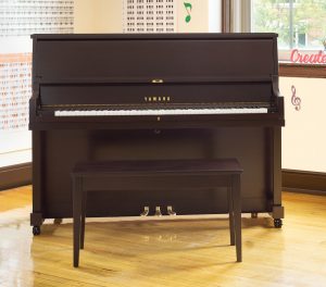 Upright studio piano.