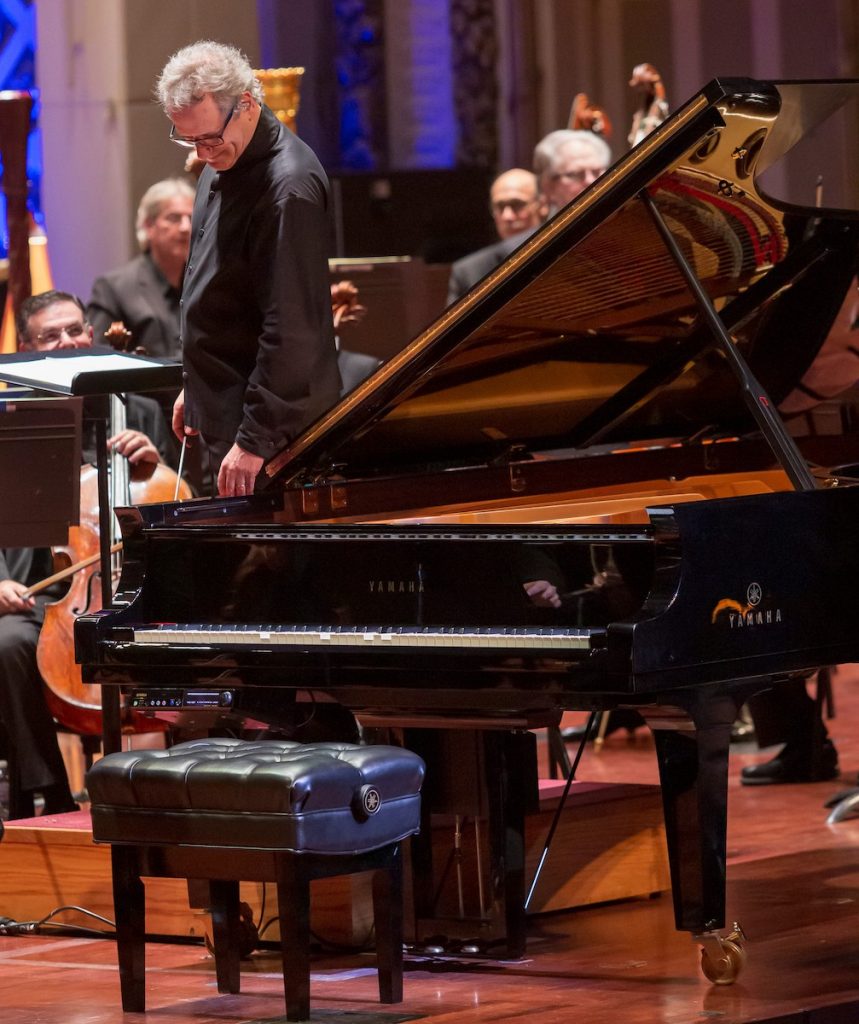 Conductor listening to Disklavier Conductor listening to Yamaha Disklavier as it reproduces Gershwin’s piano part.