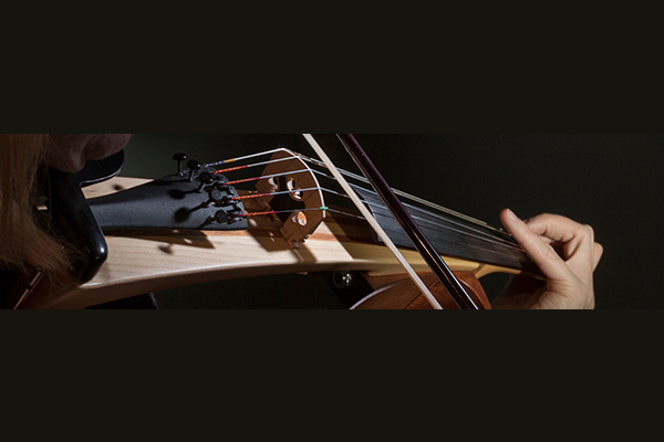 Woman playing Yamaha SILENT violin.