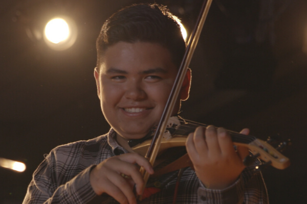 Young man playing Yamaha Electric Violin (YEV).