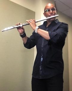 Scott Mayo playing the flute.