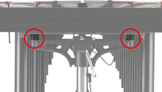 image-C-with-red-circle Side view of vibraphone with height adjustment mechanism indicated.