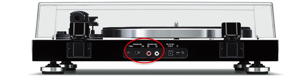 TT-S303-rear-panel-output-and-switch-circled-in-red Sideview of turntable with closed clear lid.