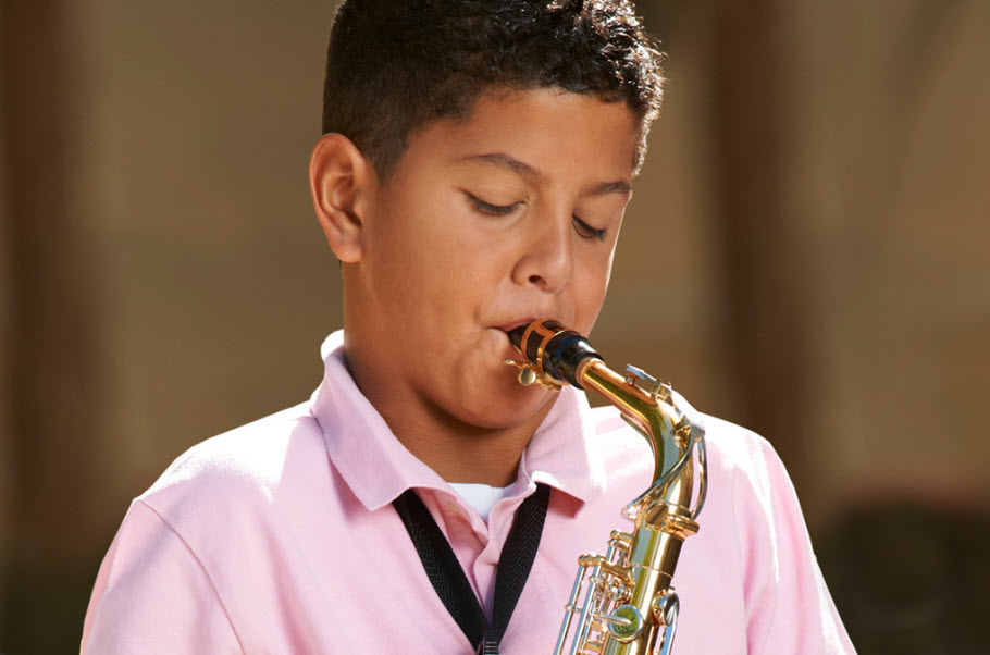 sax Young boy playing a saxophone.