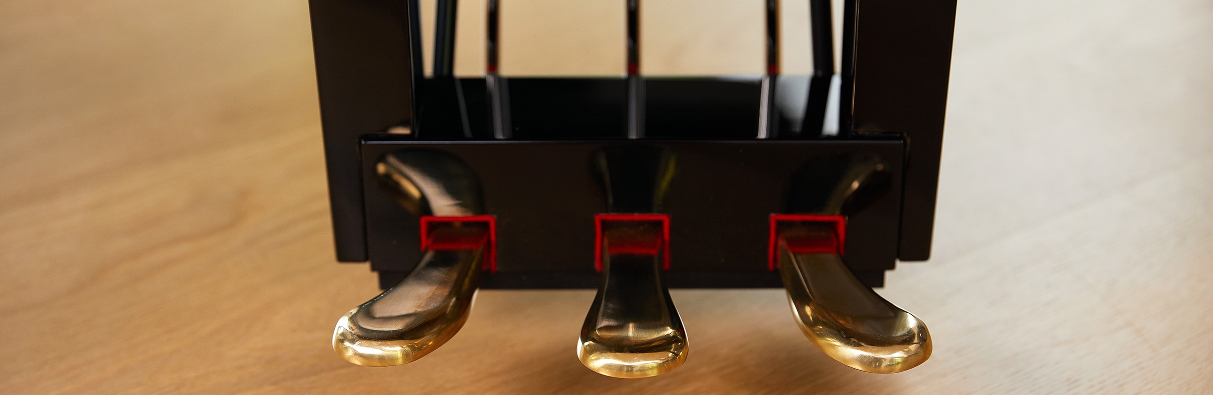 Grand-Pedals-crop Closeup of piano pedals.