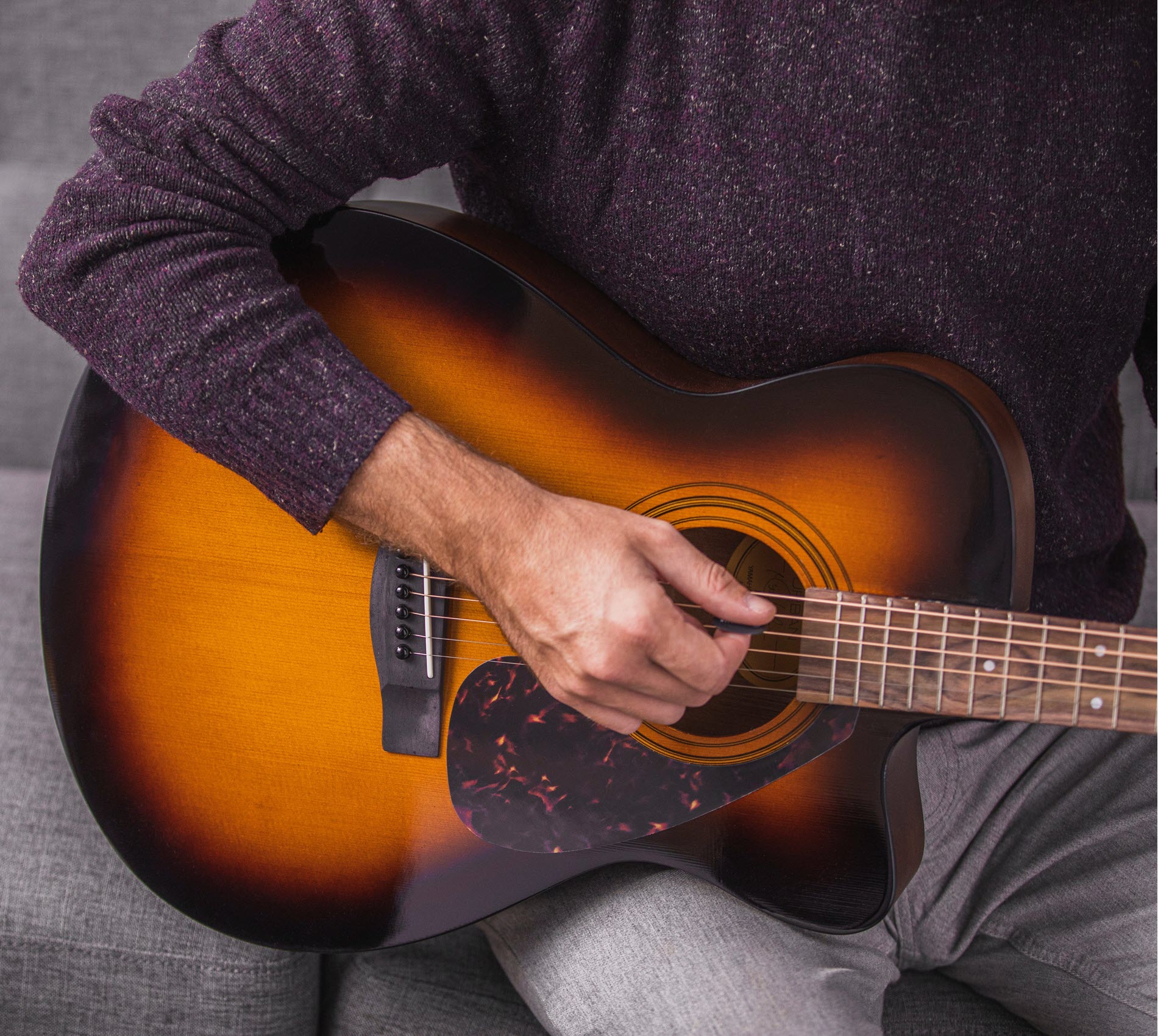 guitar-tips-2 Closeup of someone playing guitar.