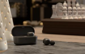 A pair of earbuds in their cases.