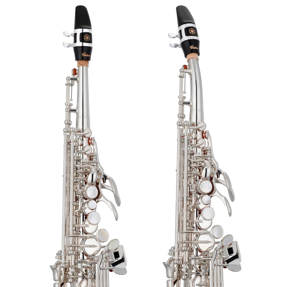 Straight-Neck-Soprano-left-Curved-Neck-right-1000 Two different silver color saxophones, one with a curved neck the other with a straight neck.