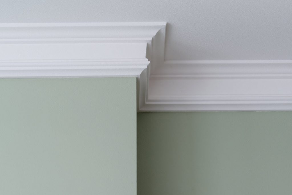 Crown-molding-resize Closeup of crown molding along the top of a wall.