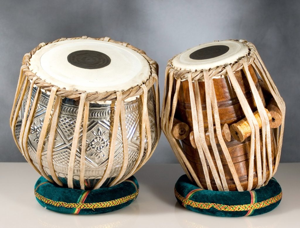 Tabla Two small wooden drums with raffia wrapping.
