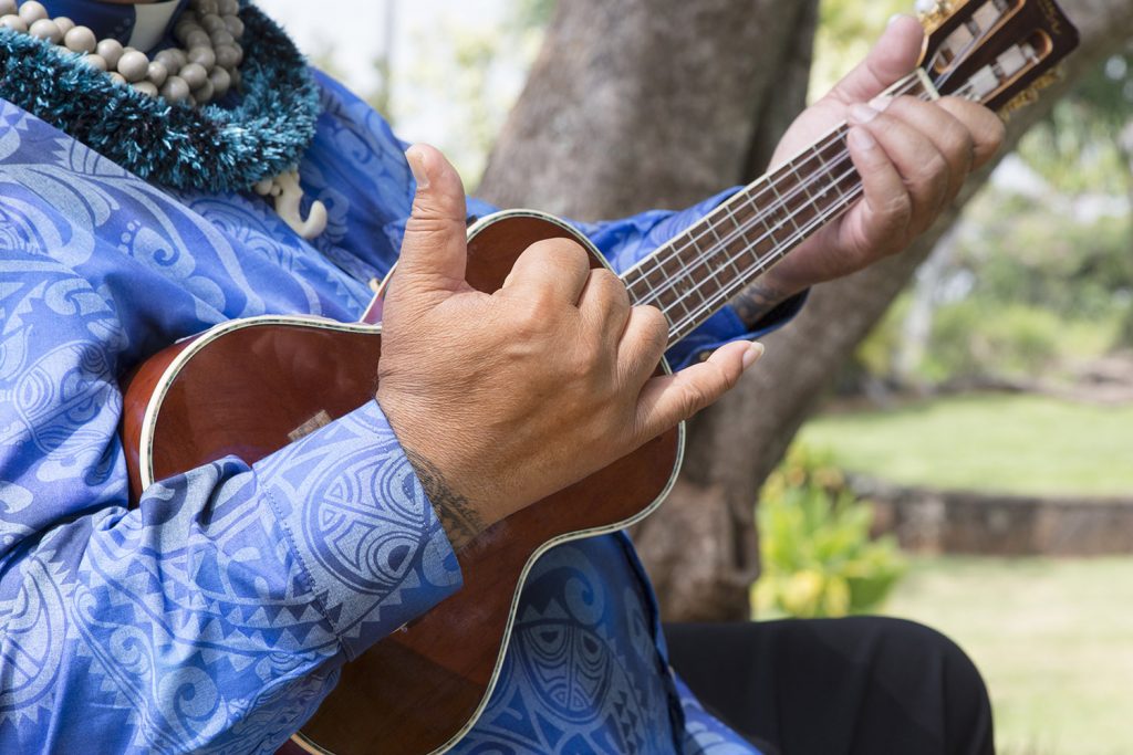 Ukulele Closeup of man playing a ukelele.