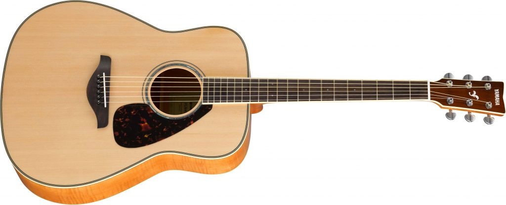 Acoustic guitar with light color body.