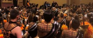 Johnson High School band in show costumes in auditorium