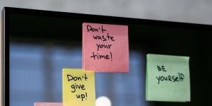 positive Post-Its on computer screen
