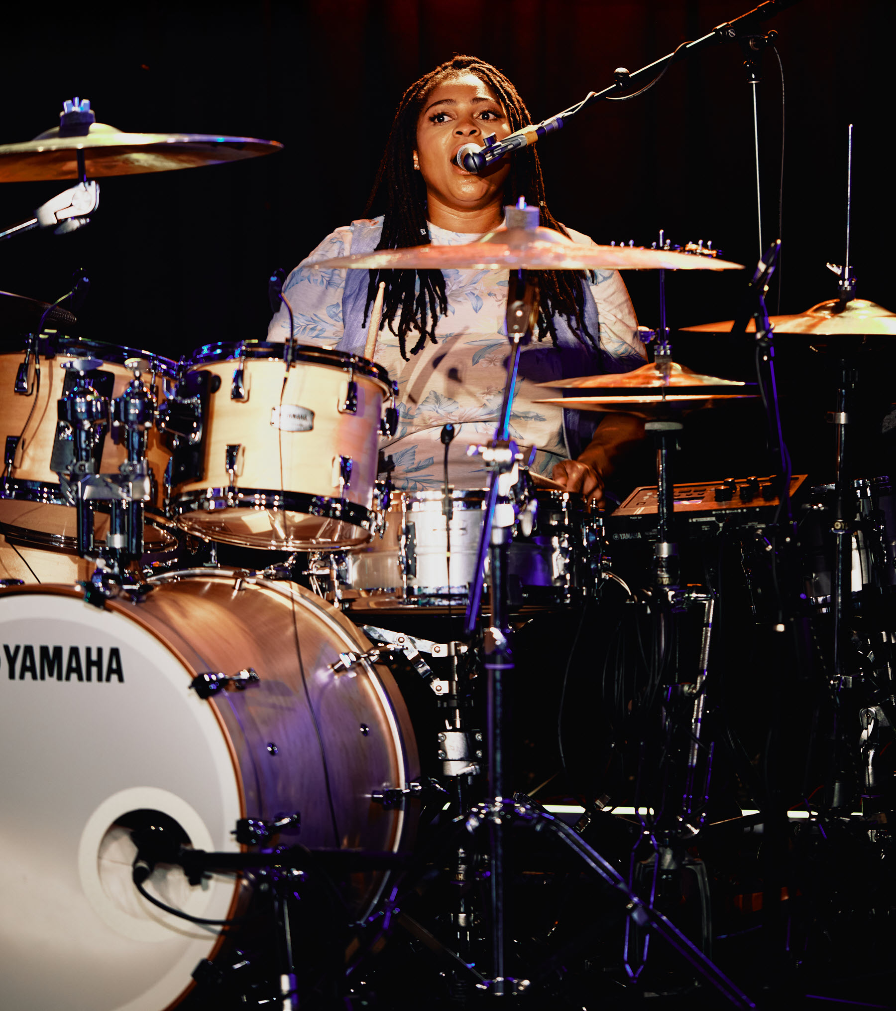 Nikkie-Glaspie-body-image-2-resize Woman playing drums.