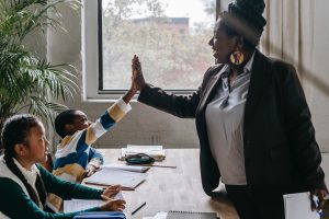 teacher high-fiving student