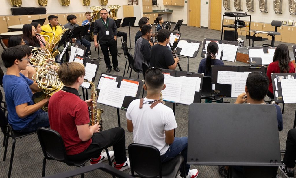 music rehearsal with director standing in the middle of the room