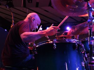 Man playing drums.