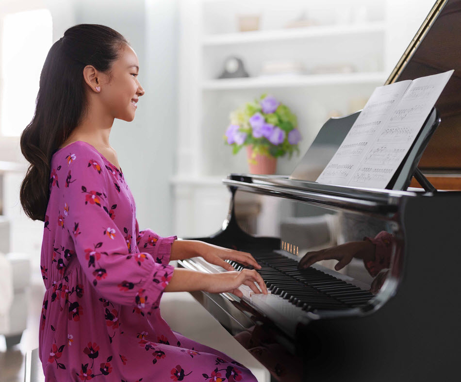 Young girl playing piano.